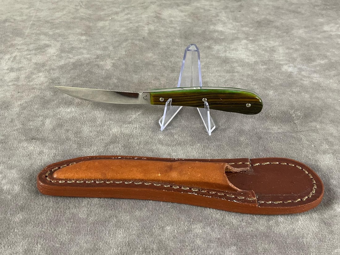 Brown Synthetic Knife: Case Select XX Fixed-blade desk knife. 617-3 154 CM. Includes leather sheath. Measures 7 inches long X 2 inches wide.