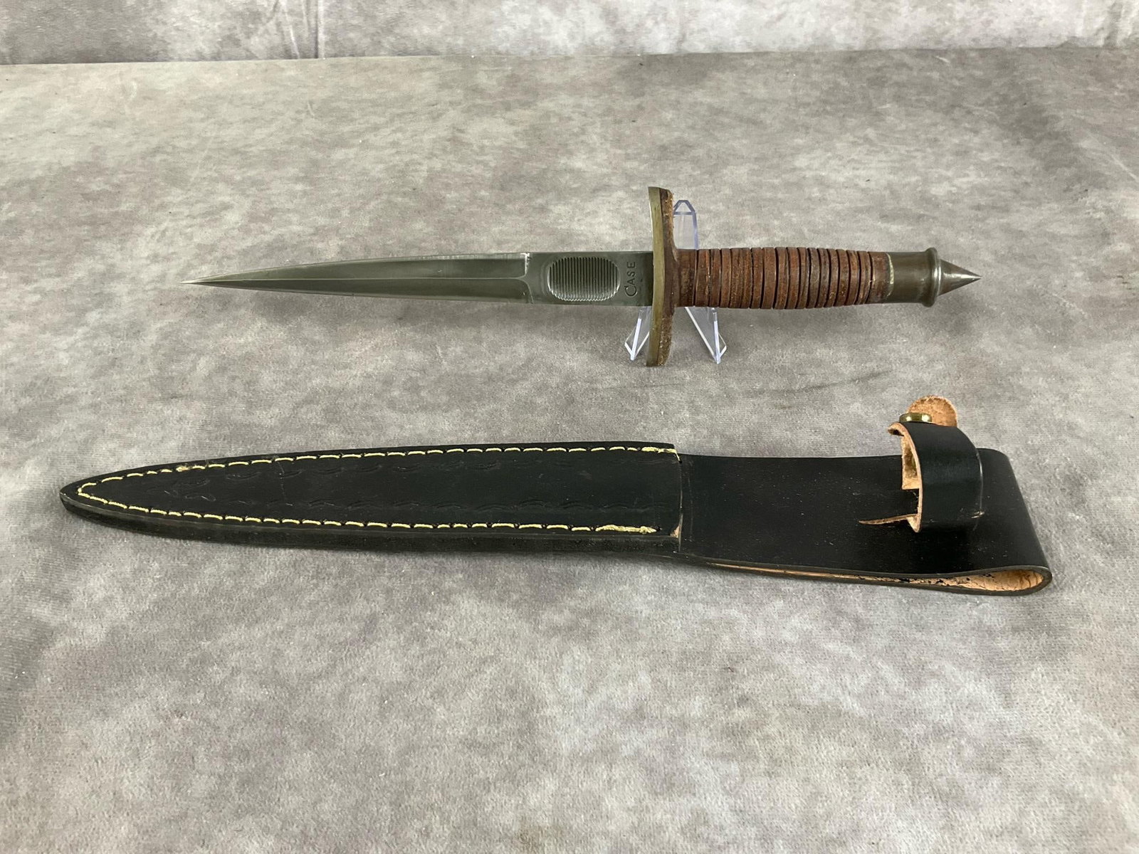 V-42 Stiletto: Meneray 9906 Case handmade replica of the classic World War II US Special Forces combat knife. Includes sheath. Measures 14 inches long X 3 inches wide.