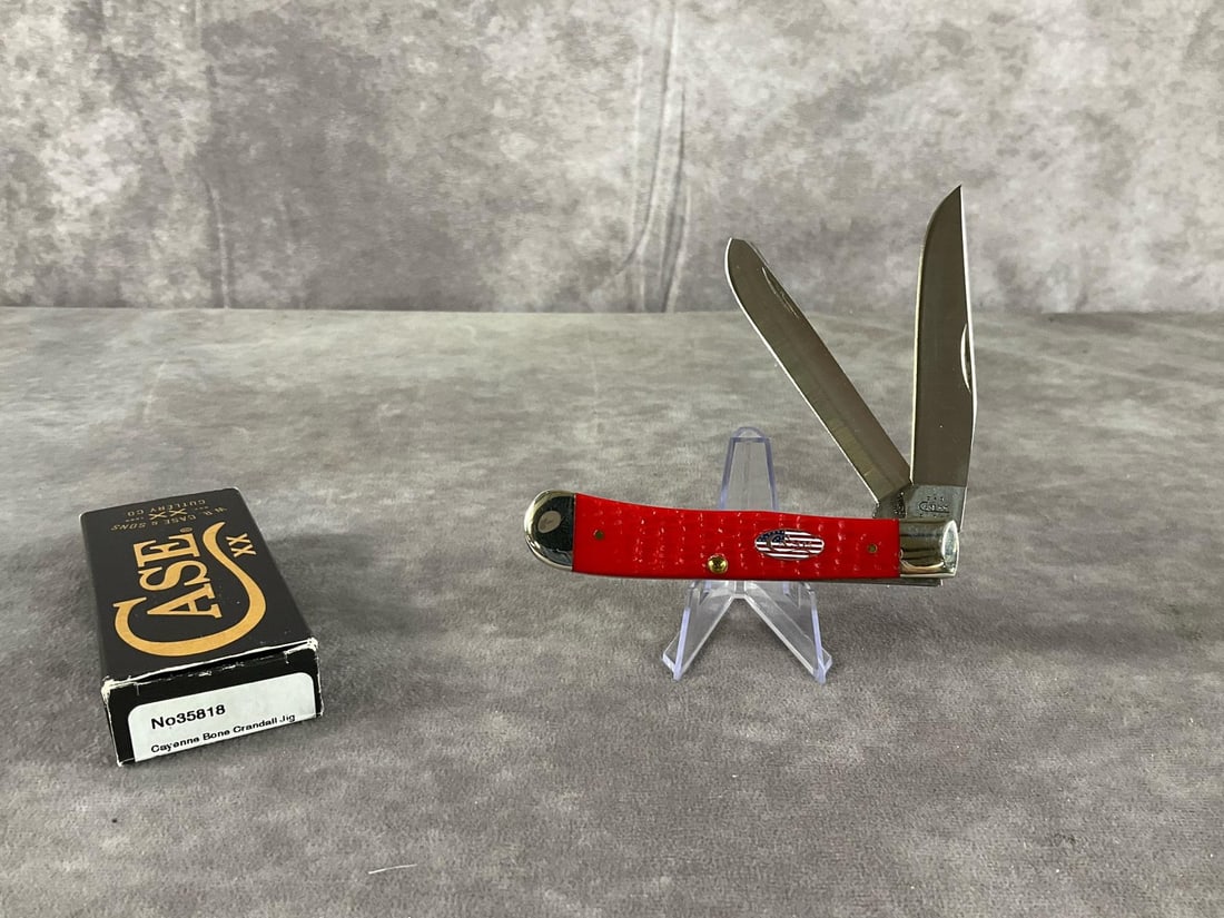 Jigged Red Bone with American Flag Inlay Knife: Case XX Trapper 6254 SS Tight snap, includes box, not correct. Box measures 4.5 inches wide X 1.75 inches tall.