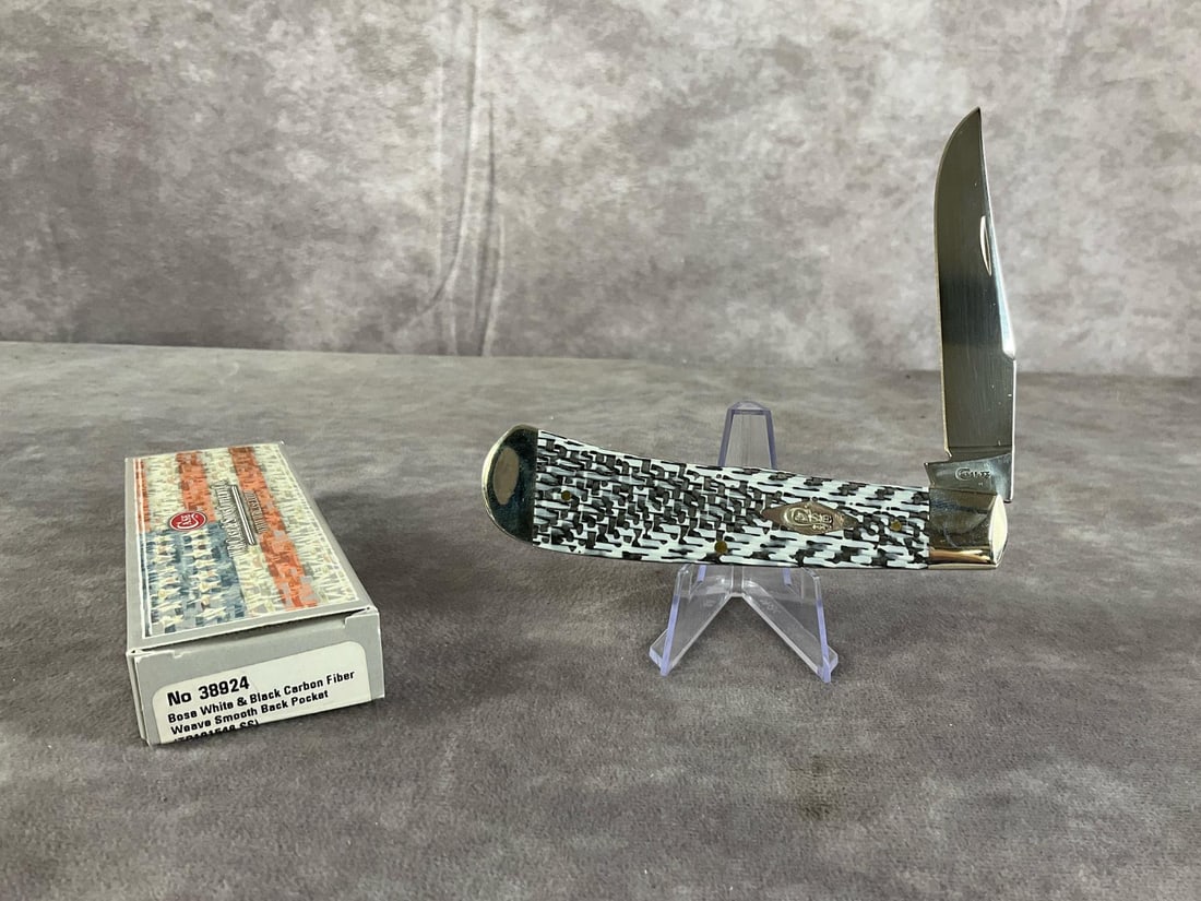 White & Black Carbon Fiber/G-10 Weave Smooth Back Knife: Case XX Tony Bose Wharncliffe Trapper, TB101548 SS Tight snap, includes original box box. Box measures 5.5 inches wide X 1.75 inches tall.