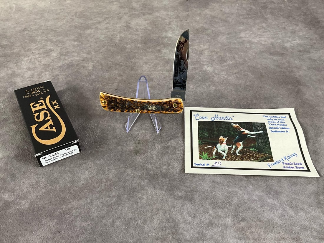 Amber Bone Peach Seed Jigged Knife: Case XX Sod Buster Jr, Special Edition Coon Huntin, # 10 of 10 , 6137 SS Tight snap, includes original box. Box measures 4.5 inches wide X 1.75 inches tall.