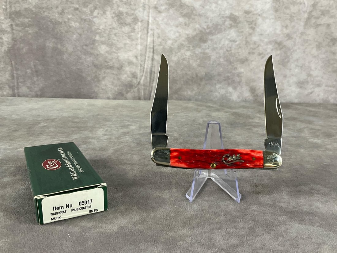 Jigged Red Bone Knife: Case XX Muskrat SS Tight snap, includes original box. Box measures 4.5 inches wide X 1.75 inches tall.