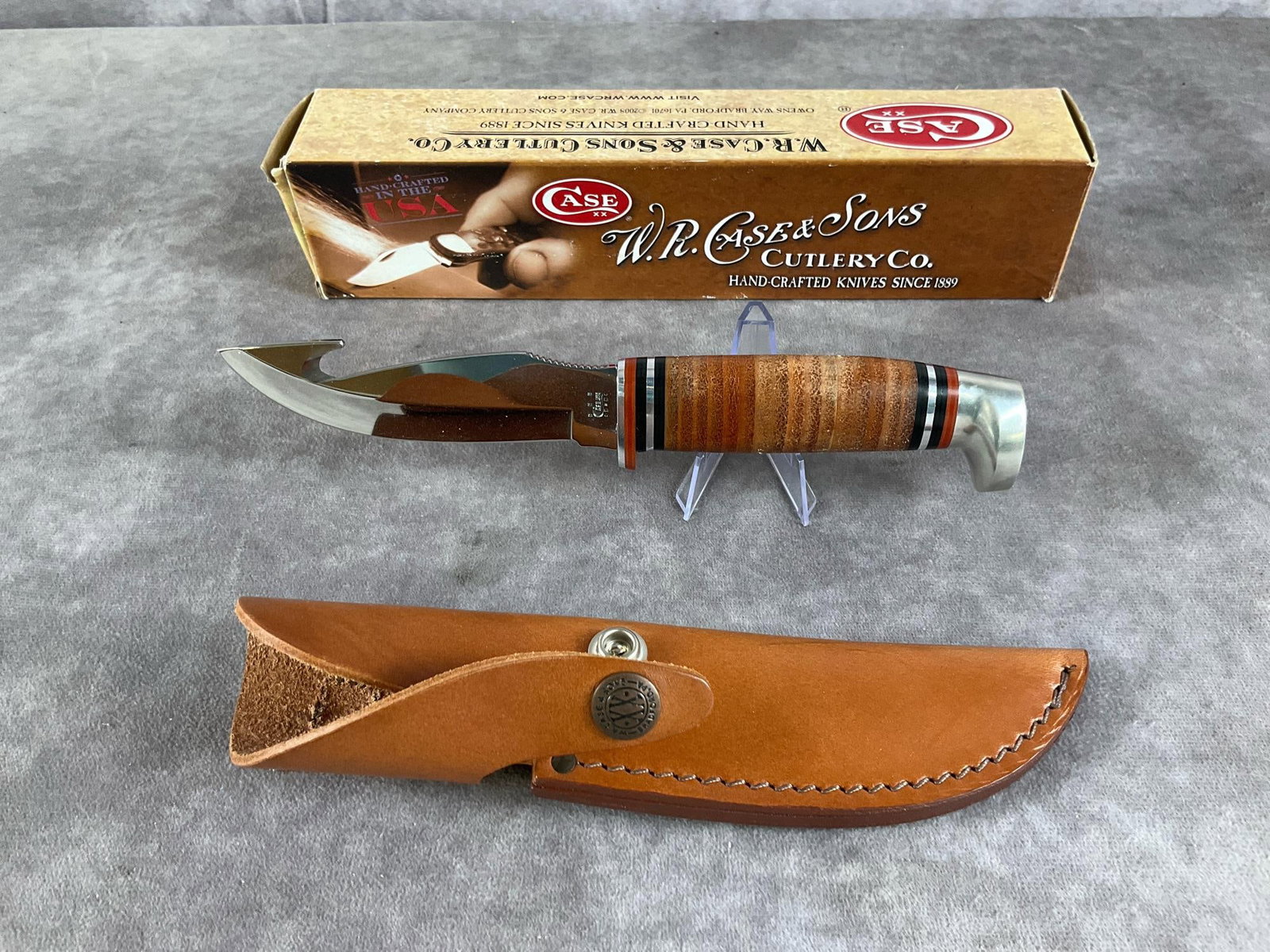 Vintage Stacked Leather Knife: Case XX Fixed Blade Hunter Guthook 375-4C SS Includes original box and sheath. Box measures 10.5 inches wide X 2.25 inches tall.