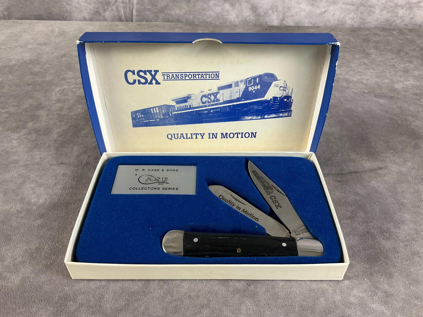 Smooth Black Synthetic Knife: Case Solingen 440 Steel CSX Transportation Railroad Collectors Series. Old Ram stamped in blade with Quality in Motion theme. Tight snap, includes original case. Case measures 7.25 inches long X 4.5