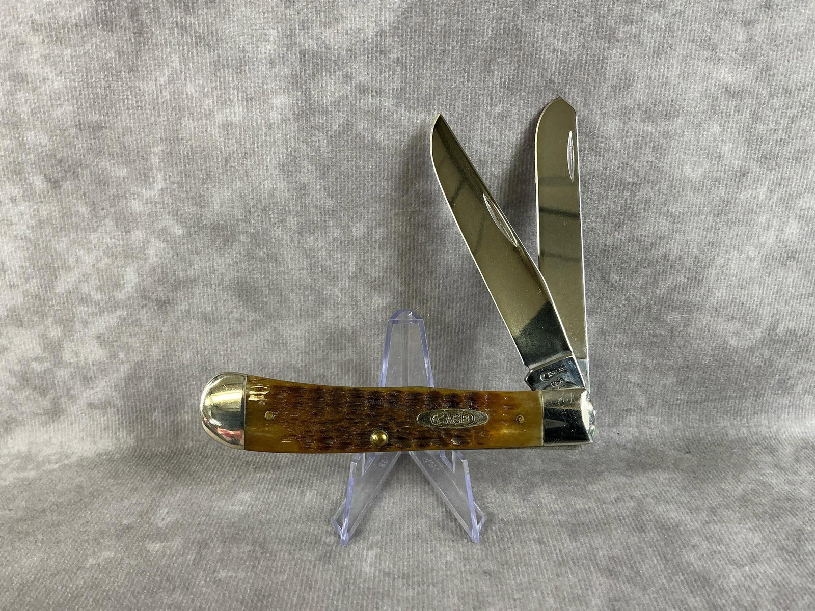 Large Trapper Knife: 1997 Case XX two blade large trapper pocketknife with bone handles, 6254 SS. Tight snap, good condition. Measures 4 inches long closed.