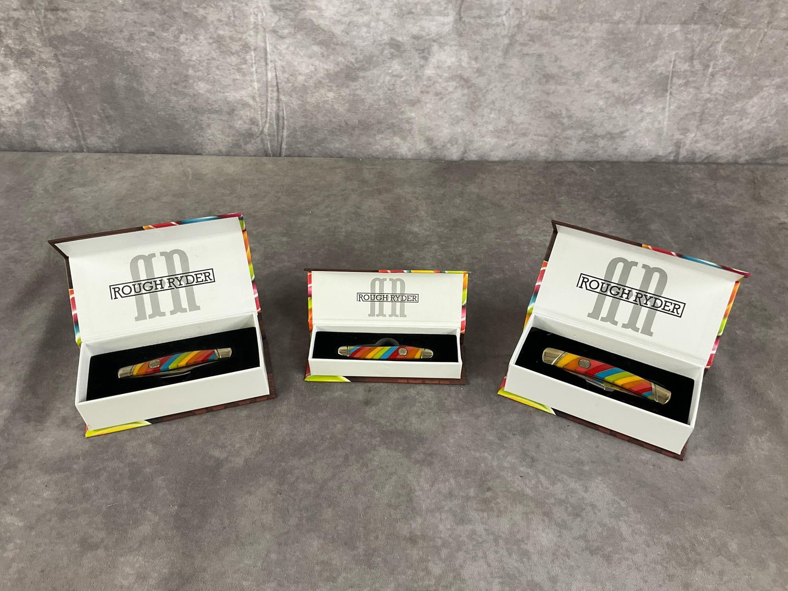 Lollipop Knifes: Rough Ryder Moskrat. RR2465 , Stockman RR2464, Moose RR2467 all with Tight snap. Largest Box measures 6 1/4 inches long X 3 inches wide X 1 3/4 inches high.