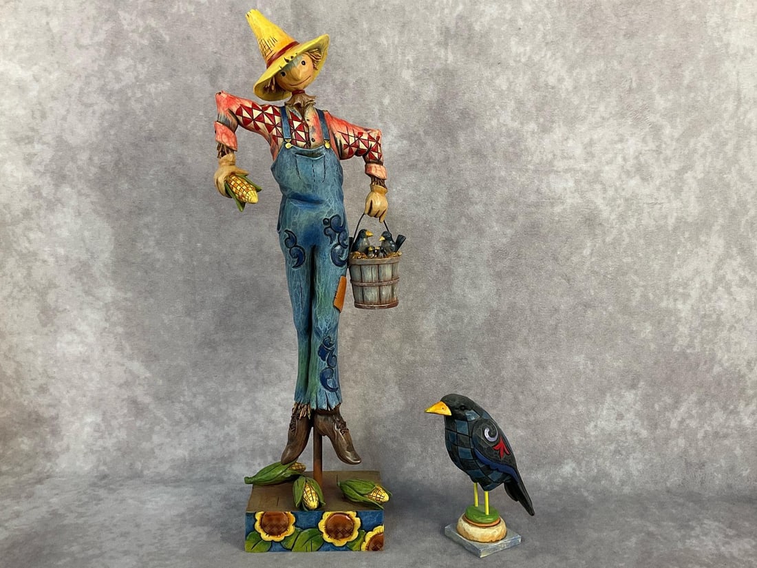 Fall Halloween Figurines: Two 2006-2009 Jim Shore Heartwood Creek collectibles. Includes a scarecrow "Scaring Up Fun" Item / SKU number 4014446 with original box, and a quilted blue crow on stand. Licensed by Enesco Group,
