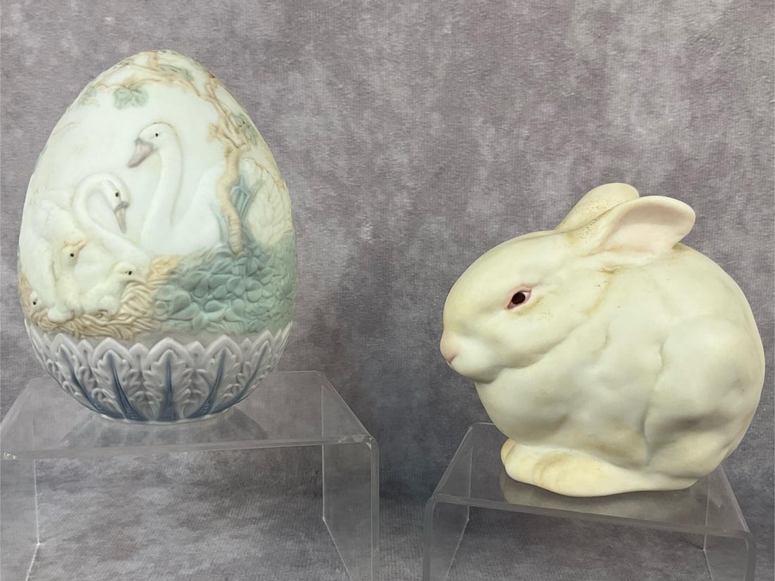 Swan & Rabbit Collectibles: Two vintage porcelain figurines. Includes Lladro swan decorated Limited Edition hand painted egg dated 1994 and Cybis Mr. Snowball Rabbit introduced in 1981. Both in good condition. Measurements for