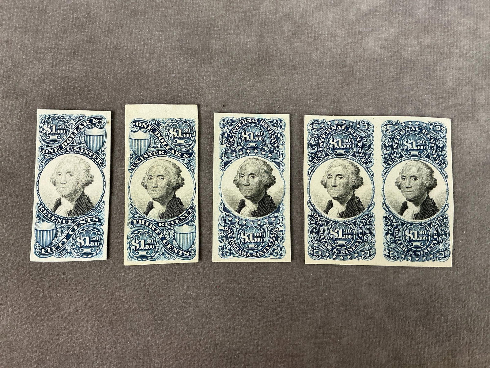Rare 1870's Washington Stamps: Five 1871-1872 blue US Postage stamps with George Washington vignette in black and white. Denominations include: $1.30, $1.50, $1.60, and 1.90. Unmarked and in good condition. Each stamp measures 1