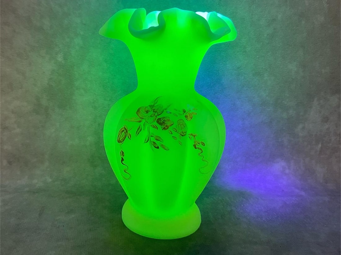 Fenton Uranium Vase: Mid century modern hand-painted Fenton uranium custard glass vase with ruffle rim. Vase is marked on the bottom. In good condition. Measures 3.5 inches long x 5.75 inches tall.