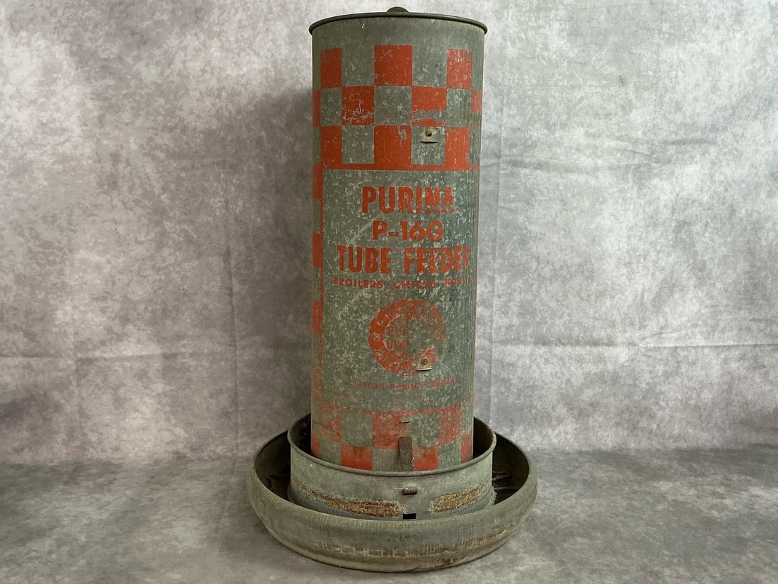 Purina Chicken Feeder: Mid 1900's poultry feeder. Purina P-16G galvanized tube feeder for chickens. Some rust, otherwise in good condition. Measures 13 inches in diameter x 20.25 inches tall.