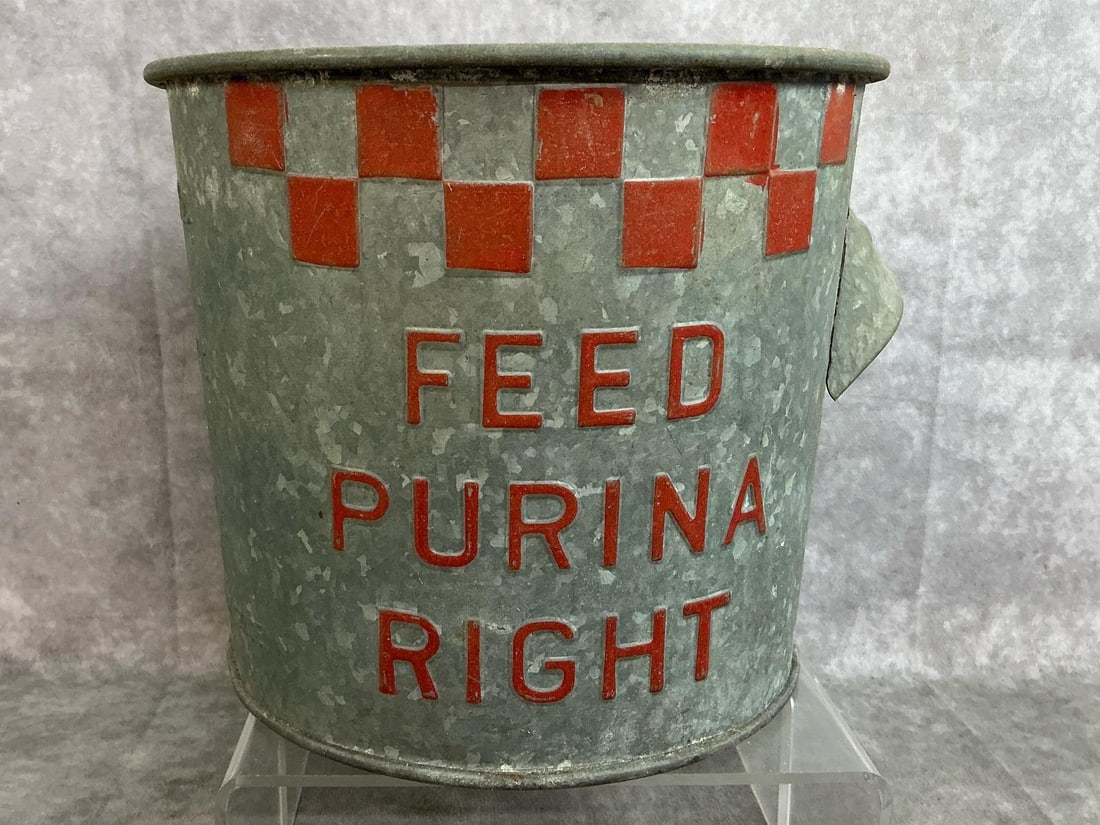 Purina Bucket Feeder: Early 1900's 1-Gallon bucket. Purina galvanized dry measure feed bucket with iconic checkerboard pattern. Slight rust, otherwise in good condition. Measures 8 inches in diameter x 7 inches tall.