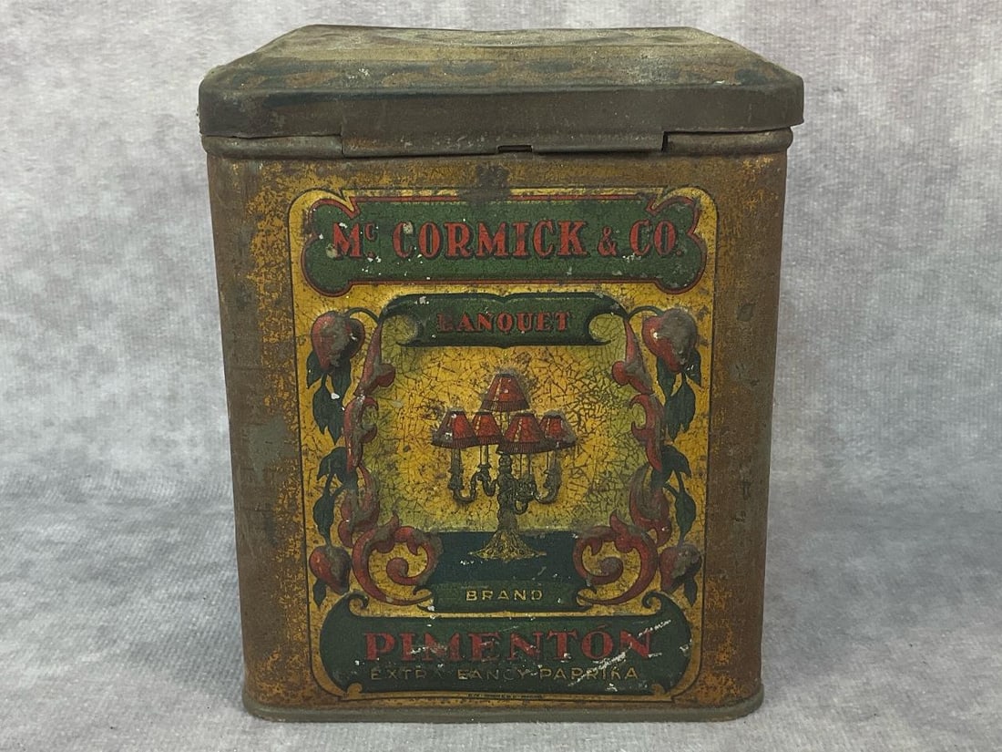 Paprika Spice Tin: Early 1900's McCormick & Co. Banquet Brand metal spice tin marked Spain on the bottom. Labeled Pimenton Extra Fancy Spanish Paprika. Normal wear from aging and lid doesn't close properly, otherwise