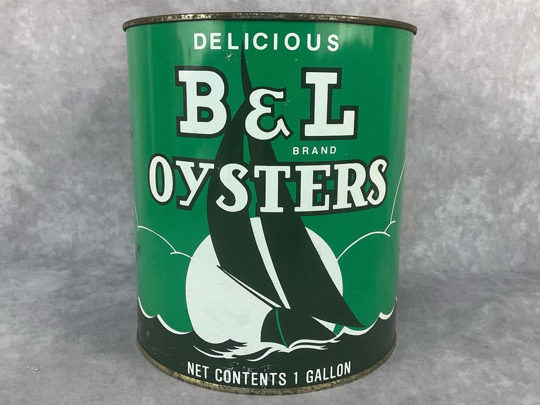 Oyster Can: Mid 20th century B & L Brand Oysters lithographed one gallon tin. Distributed by Bivalve Oyster Packing Co. Inc. Princess Ann MD. Lid stamped extra select. Normal wear and rust from aging otherwise