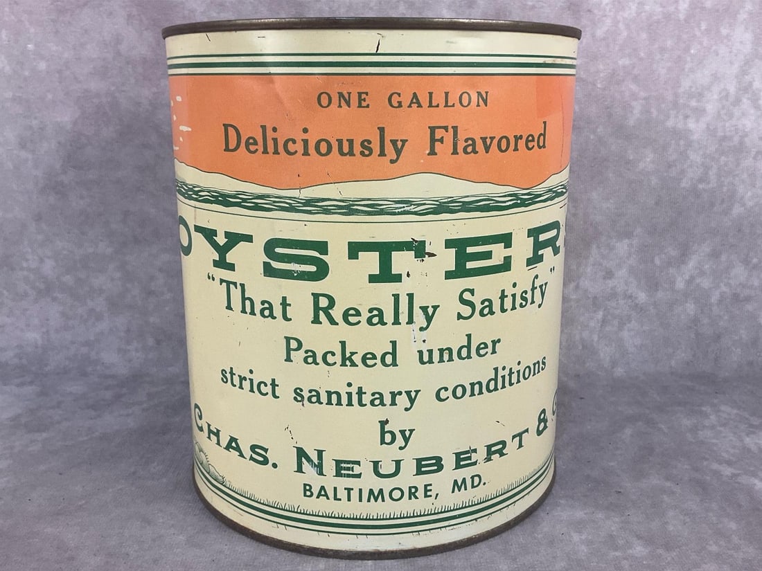 Oyster Can: 1920's - 1930's Chas. Neubert & Co. lithographed one gallon oyster tin. Lid marked extra standards. Normal wear from aging otherwise in good condition. Measures 6.5 inches diameter x 7.5 inches tall.