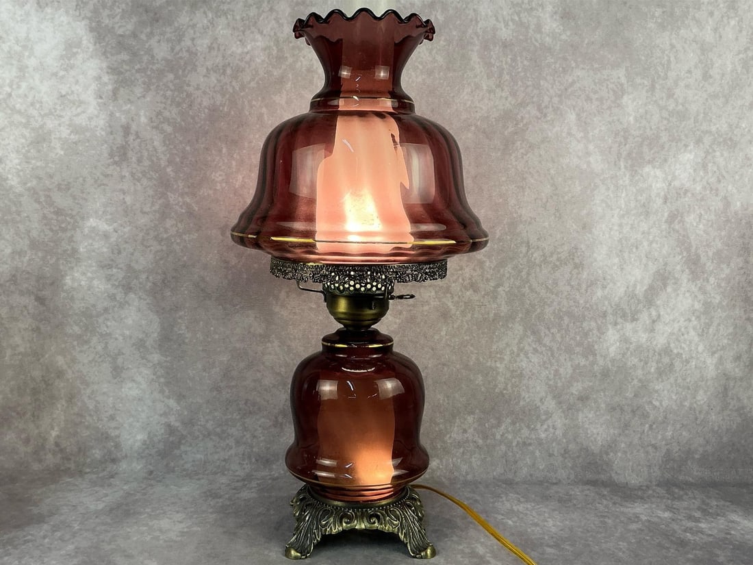 Hurricane Lamp: Modern Amethyst purple glass Gone With the Wind style three way electric hurricane lamp. Tested and in good condition. 22 inches tall x 11 inches wide.