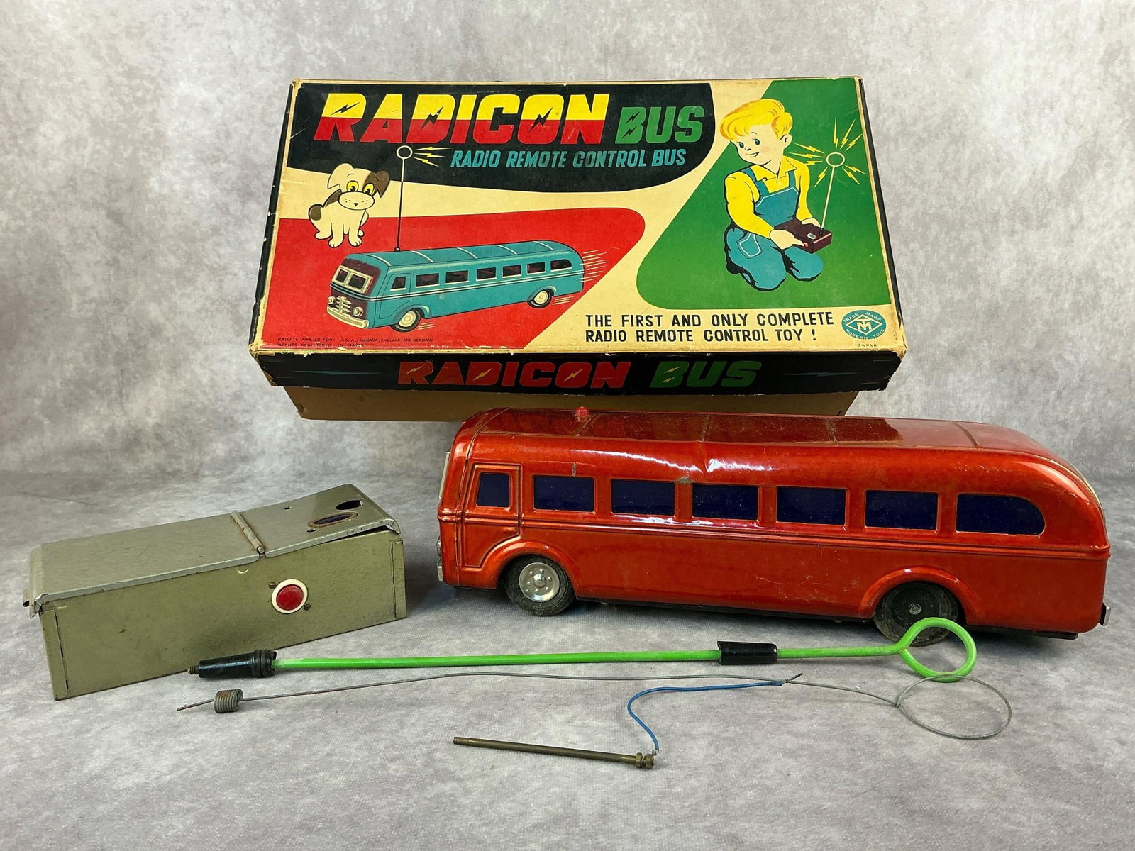 Radio Remote Control Bus: Circa 1950's Radicon radio remote control toy bus. Trade Mark Modern Toys. Untested and normal wear for age otherwise in good condition. Box measures 16 inches long x 9 x 4.75 inches tall.