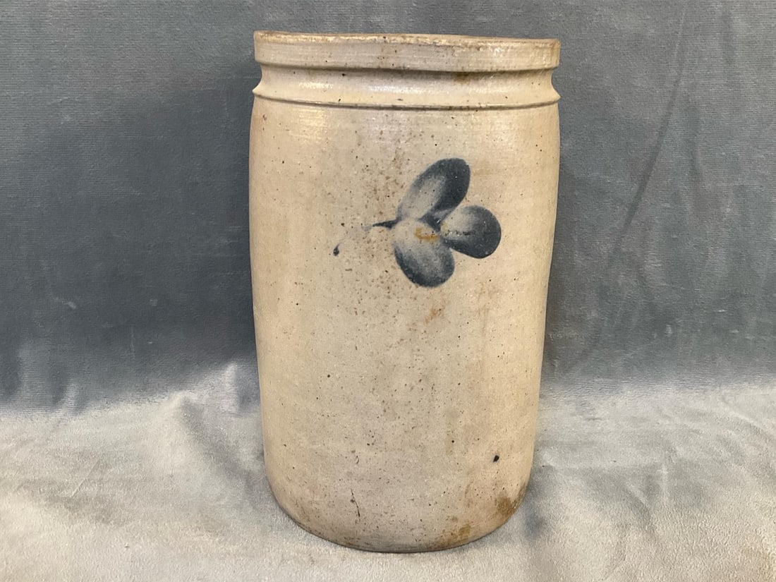 Stoneware Crock: Circa 1870's salt glazed stoneware jar/crock with cobalt three leaf clover decoration. Attributed to Peter Hermann, Baltimore, Maryland. Good condition. Measures 5.25 inches in diameter x 8.75 inches