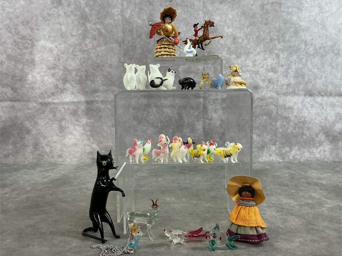 Miniature Animals & Figures: Twenty-Nine glass and shell figures. Includes five clear glass and eighteen white glass animals, two shell figures, and more. In good condition. Black cat is 2 inches wide x .75 x 3.5 inches tall.