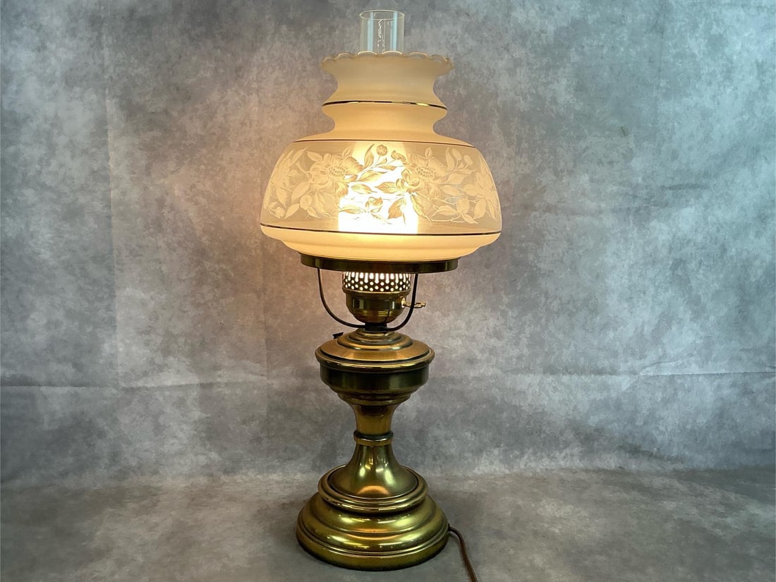 Glass & Brass Hurricane Lamp: 1970's Quoizel "Gone with the Wind " style table lamp. Satin lace frosted and etched glass shade on brass finished metal base. Tested and working. Measures 10 inches wide x 24 inches tall.