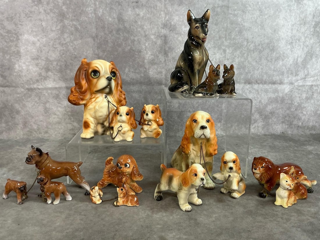 Ceramic Dog-Family Sets: Five mid 1900's dog family sets and a lion family set. Pups are connected by small chains. Includes Cocker Spaniels, German Shepherds, Boxers, and a Lion with cubs. A few scratches, otherwise in good
