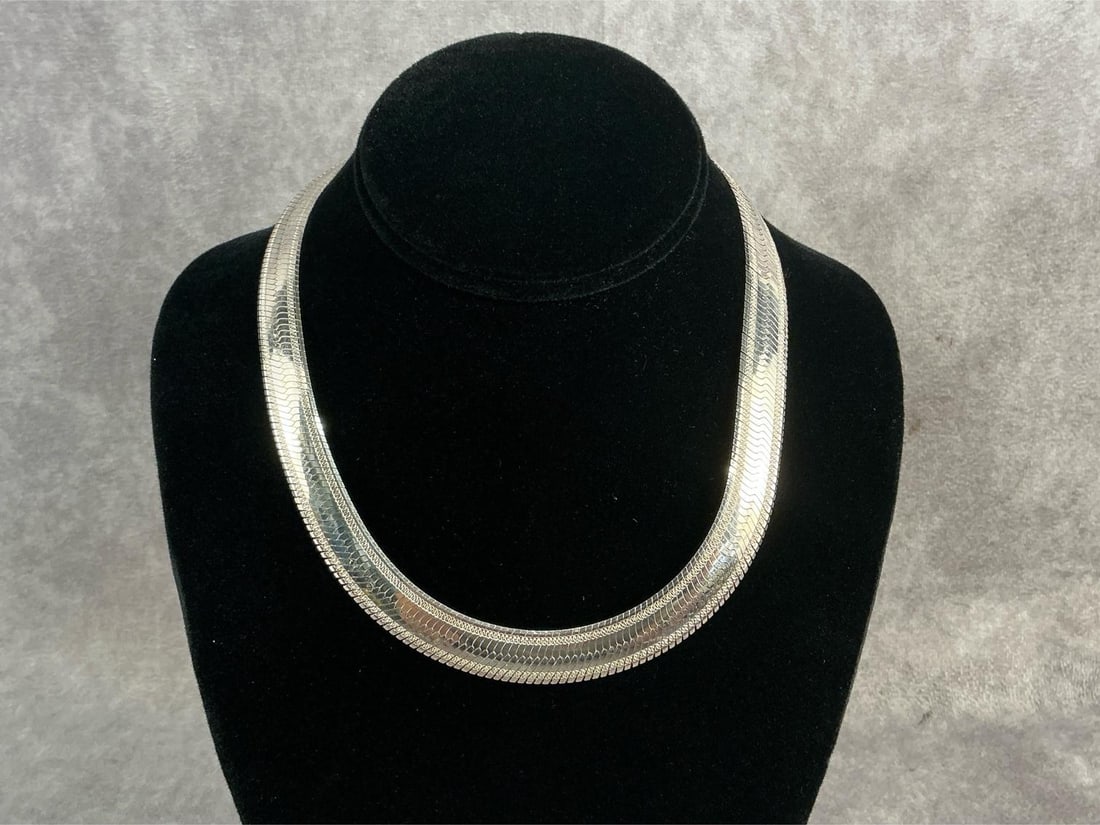 Sterling Necklace: Sterling silver herringbone chain necklace polished flat snake design. In good condition, stamped with oxidation present. Total weight 1.46 ozt.