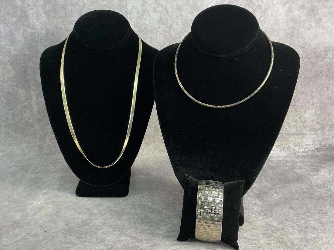 Sterling Silver Jewelry: Two sterling silver necklaces and sterling silver diamond cut woven pattern bracelet. All in good condition, stamped with oxidation present. Total weight 2.25 ozt.