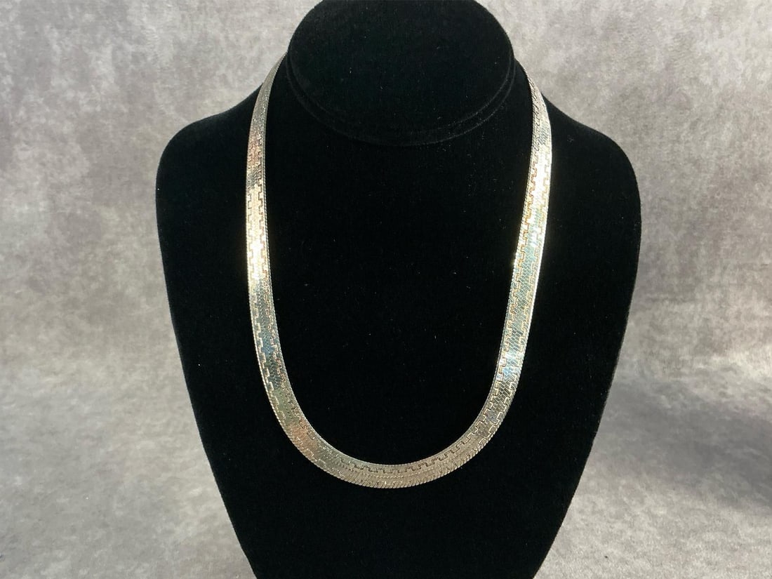 Sterling Chain: Sterling silver flat herringbone chain with a textured Greek pattern. In good condition, stamped with oxidation present. Total weight 1.12 ozt.