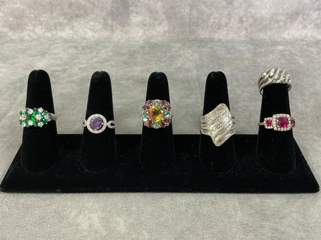 Sterling Silver Rings: Six sterling silver rings with a variety of stones and settings. All size 10 and stamped 925. All in good condition. Total weight is 1.215 ozt.