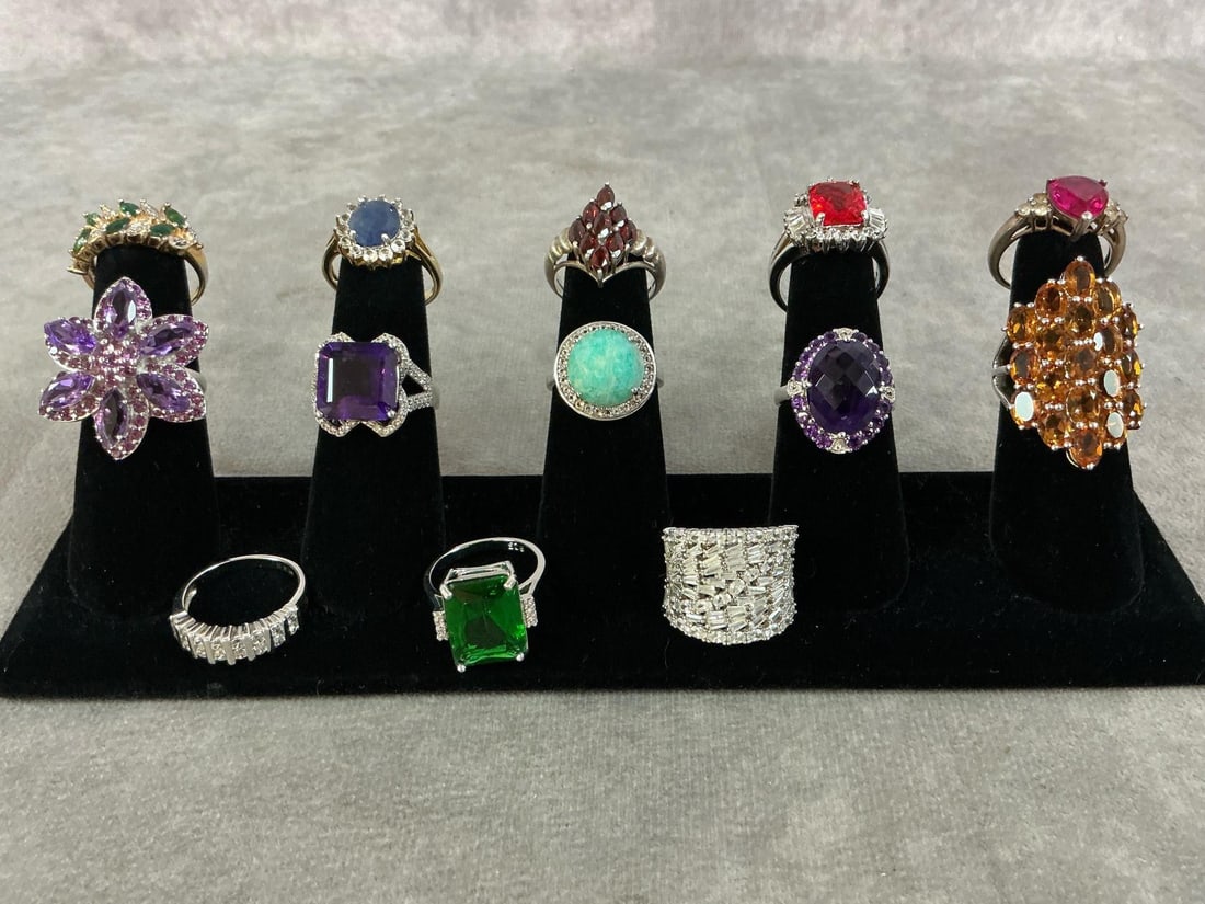 Sterling Silver Rings: Thirteen sterling silver rings with a variety of stones and settings. All size 8 and stamped 925. All in good condition. Total weight 2.50 ozt.