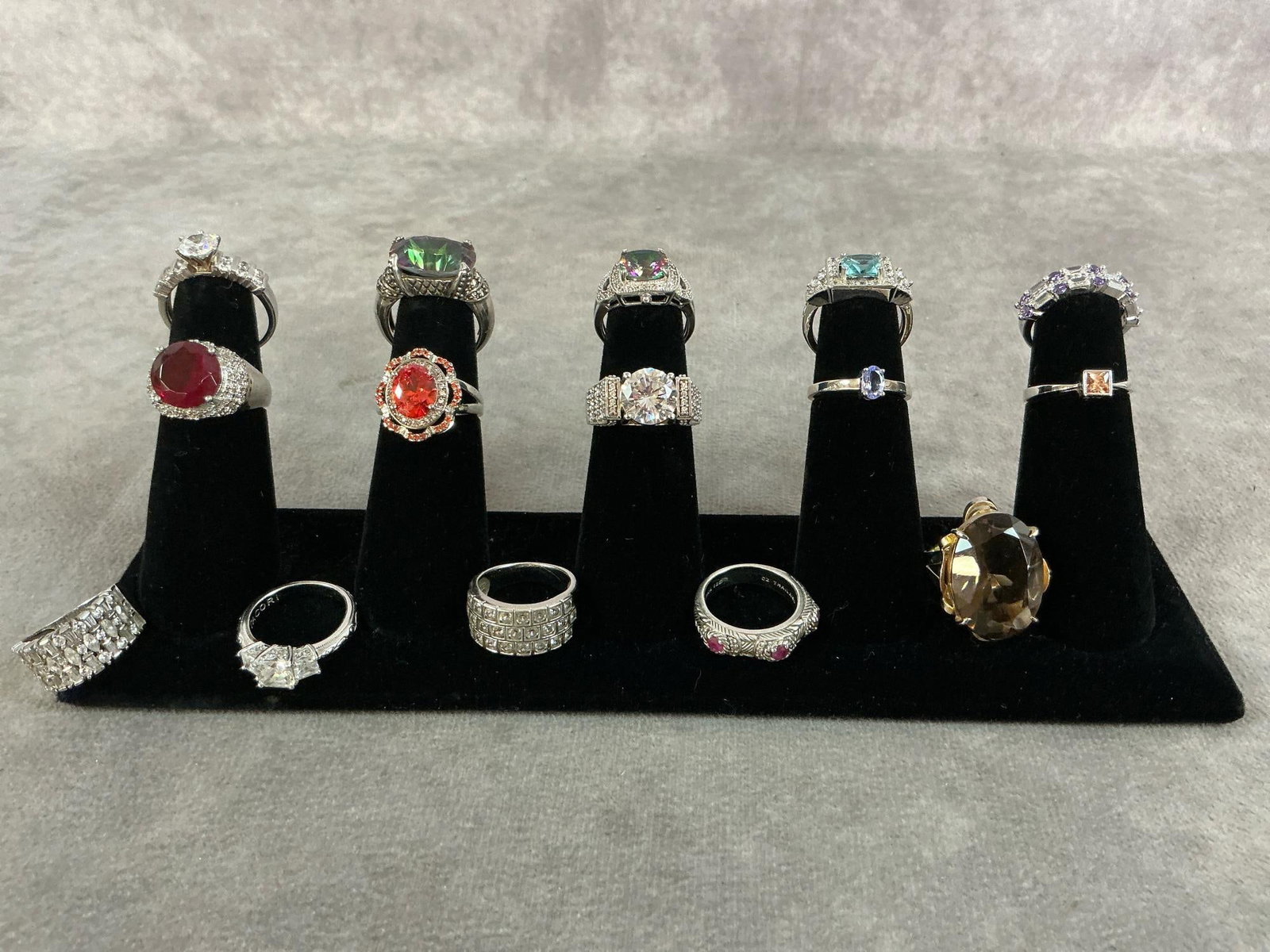 Sterling Silver Rings: Fifteen sterling silver rings with a variety of stones and settings. All size 6 and stamped 925. All in good condition. Total weight 2.31 ozt.