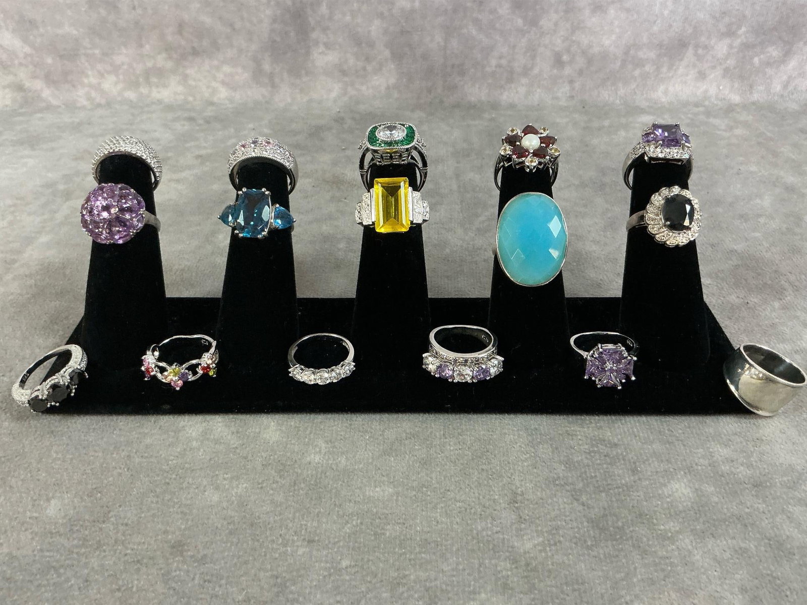 Sterling Silver Rings: Sixteen sterling silver rings with a variety of stones and settings. All size 6 and stamped 925. All in good condition. Total weight 2.78 ozt.