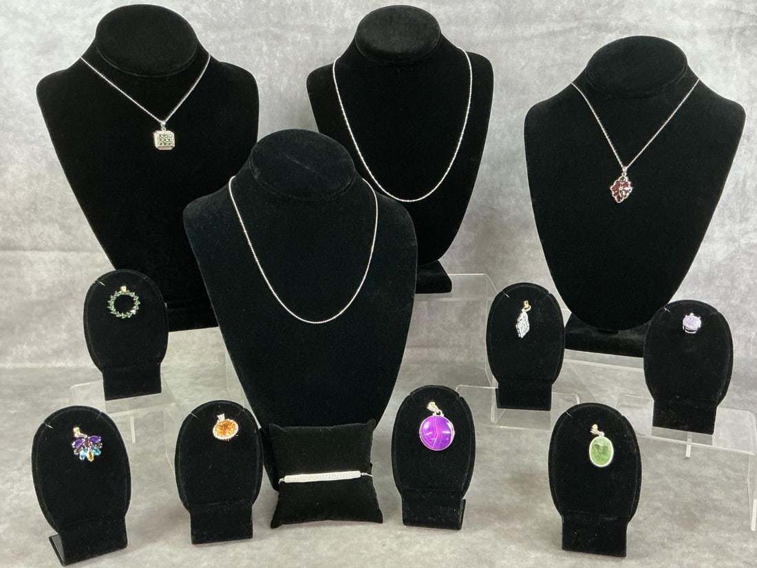 Sterling Silver Pendants & Chains: Eleven pieces of sterling silver pendants and chains with a variety of stones and settings. All stamped 925. All in good condition. Total weight 1.63 ozt.