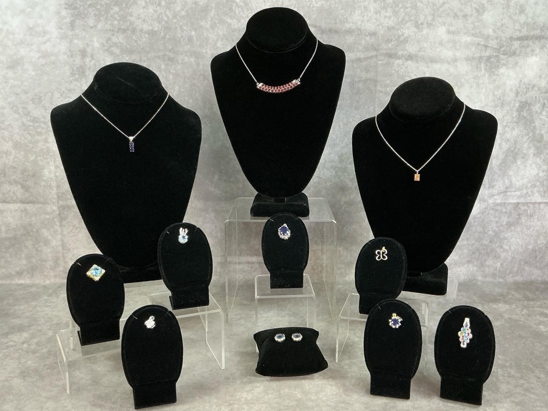 Sterling Silver Chains & Pendants: Eleven pieces of sterling silver pendants and chains with a variety of stones and settings. All stamped 925. All in good condition. Total weight 1.24 ozt.
