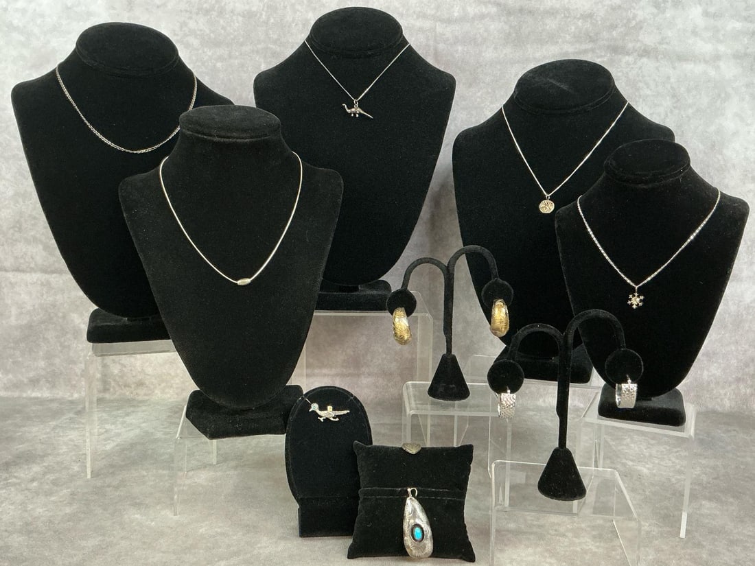 Sterling Silver Necklaces & More: Assorted lot of 10 sterling silver jewelry pieces. Including pendants, chains, earrings and a brooch. Variety of stones and settings. All stamped 925. All in good condition. Total weight 1.125 ozt.