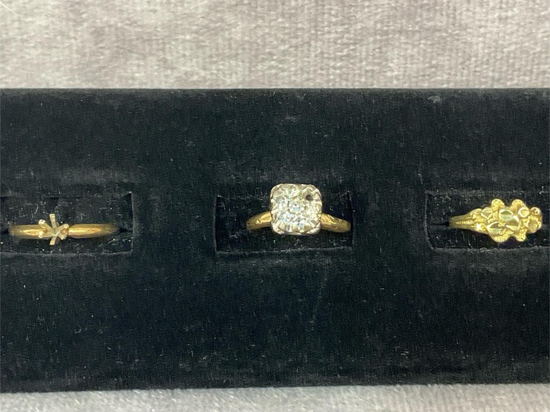 Gold Rings: Three women's gold rings. All are gold stamped. Two of the rings are missing stones and one has a broken band. Otherwise all in good condition. Total weight 4.0 dwt.