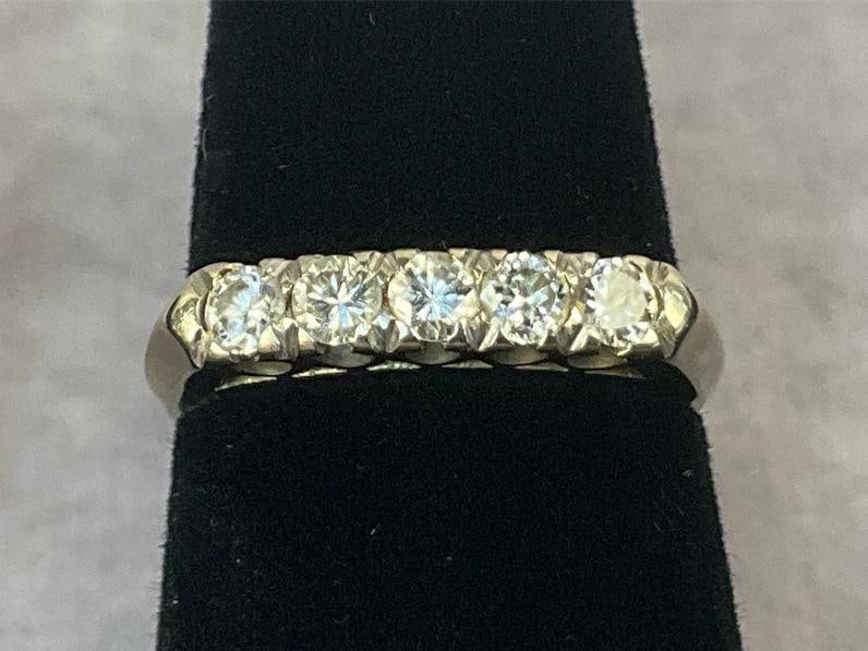 14 kt Diamond Eternity Ring: 14kt gold diamond wedding band ring. Gold stamped 14kt and diamond tested. Women's size six. In good condition. Total weight 2.0 dwt.