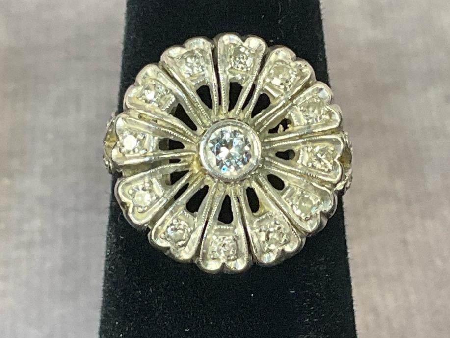 Rhodium Plated Diamond Ring: Vintage Rhodium plated over gold diamond cocktail ring. Rhodium stamped and diamond tested. Women's size five. In good condition. Total weight 2.9 dwt.