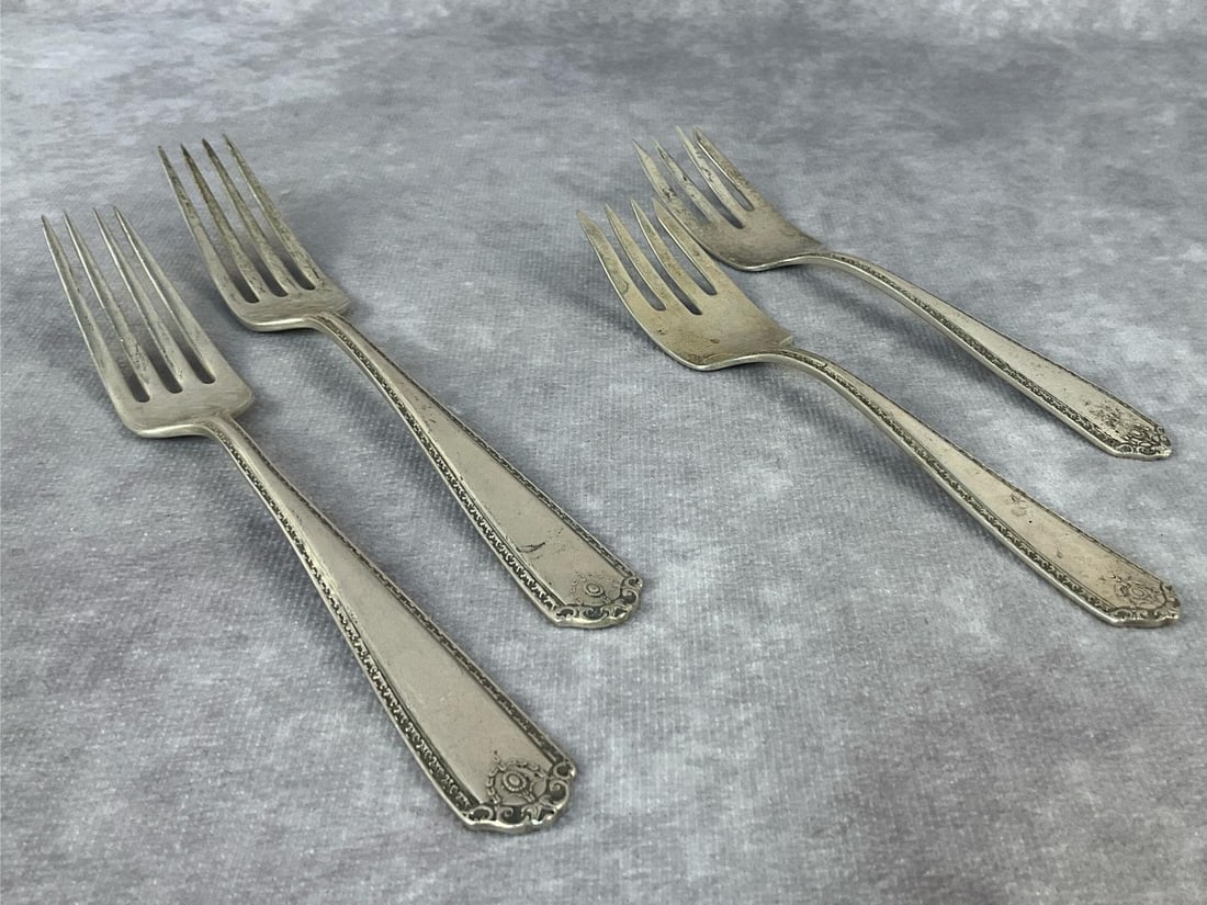 Westmoreland Forks: Four Westmoreland sterling silver forks. Two dinner forks and two salad forks. All in good condition. Total weight 5.21 ozt.
