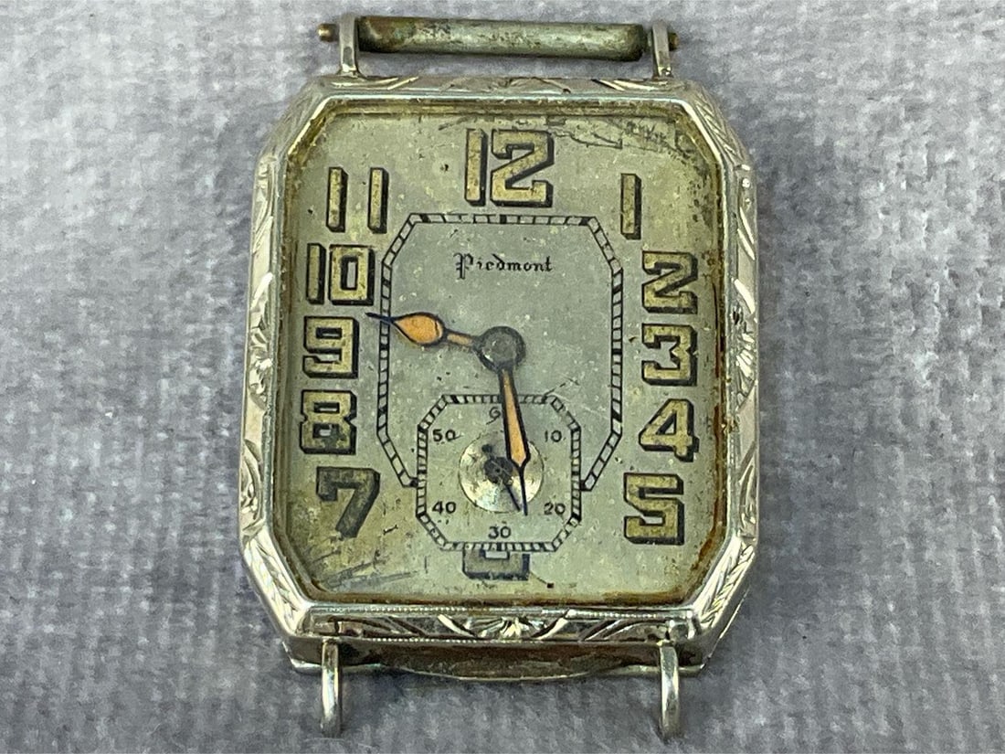 Sterling Watch Face: Vintage Peidmont sterling silver watch face. Untested. In good condition. Total weight 1.00 ozt.