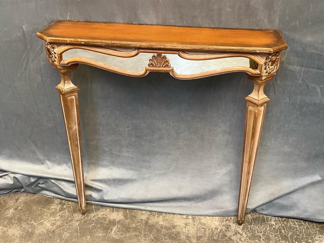Console Table: Mid-20th century Italian Florentine style wall-mounted console table with distressed finish and three inset mirrors on the skirt. Two small cracks to the rear table top, otherwise good condition.