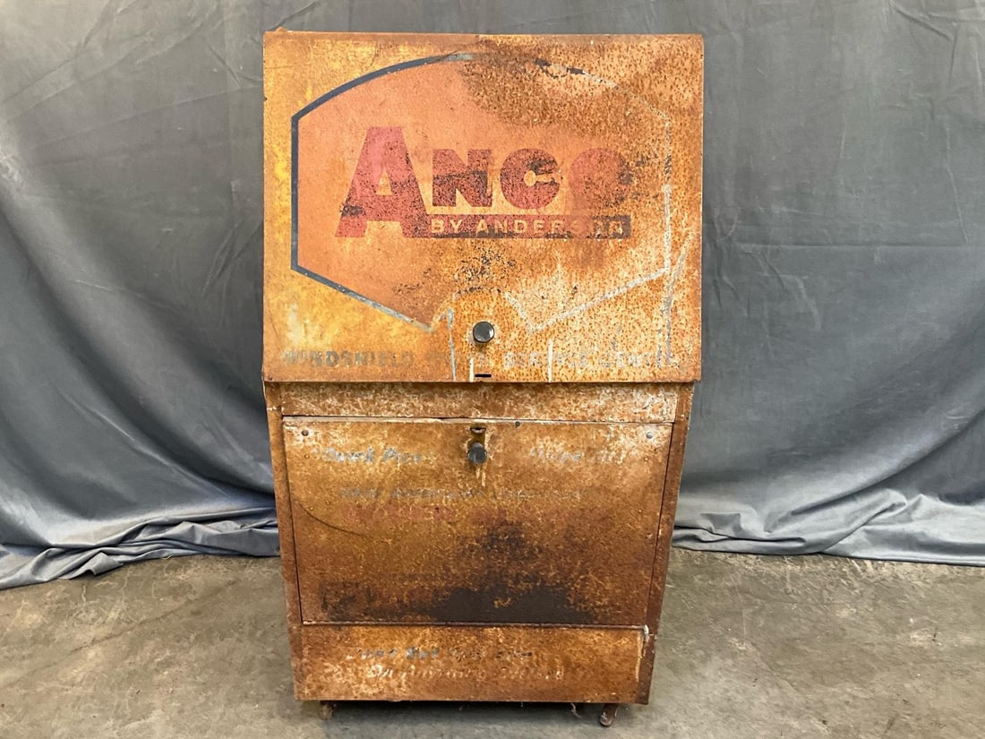 Ad Display Cabinet: 1950's-1960's ANCO by Anderson Windshield Wiper Service Center metal rolling cabinet/display cart. Surface rust, fading with several minor dents. Measures 22.5 inches wide x 25 x 42.5 inches tall.