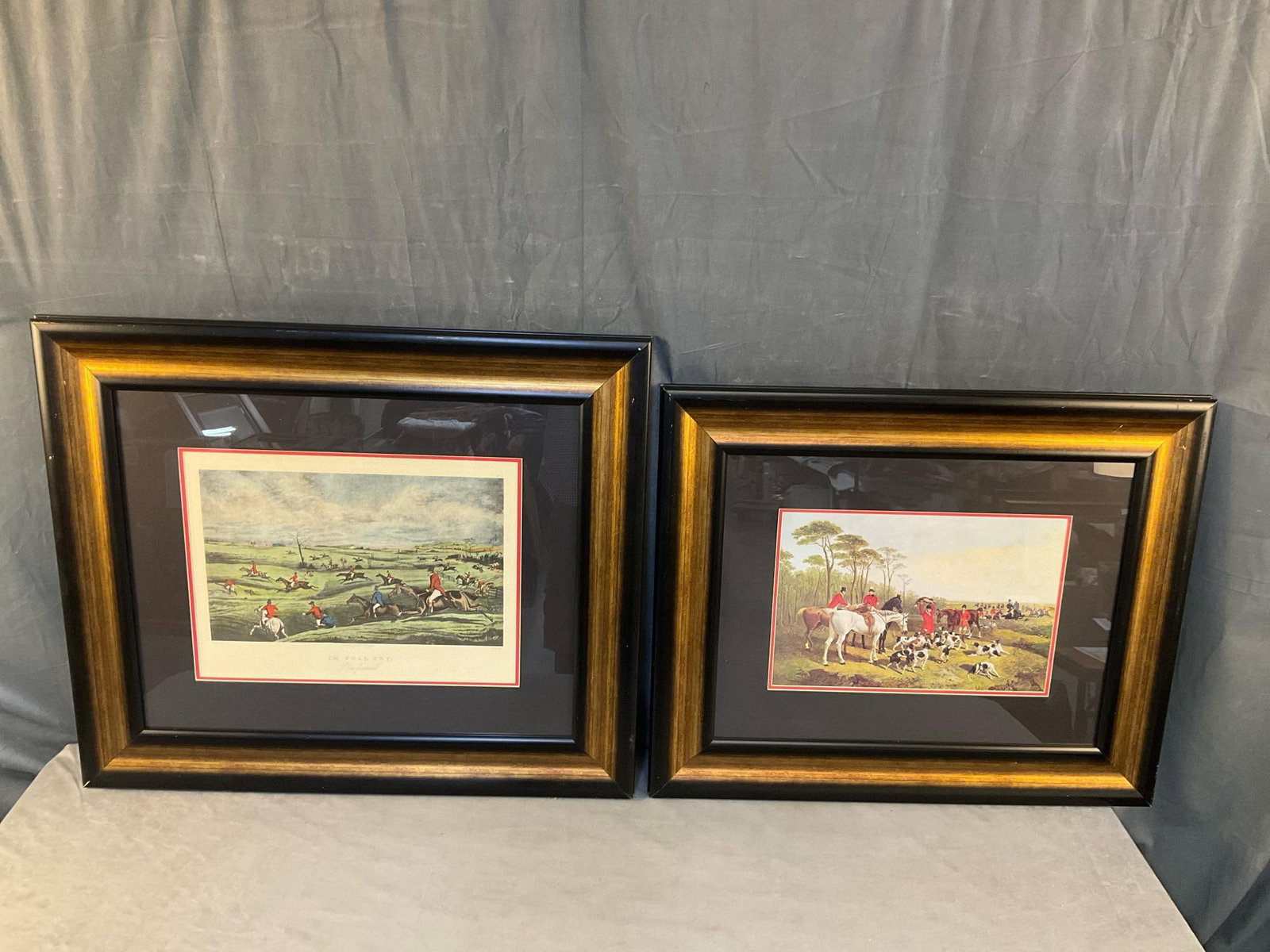 Hunting Prints: Two modern reproduction framed and matted English fox hunting prints. "In Full Cry." hand coloured matted and framed print and an untitled matted and framed fox hunting print. Good condition. "In