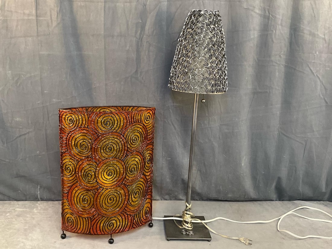 Decorative Lamps: Two modern decorative lamps. Tested, both in working condition. Metal shade missing area to shade top, otherwise both in good condition. Lamp with metal shade measures 7 inches wide x 7 x 34.5 inches