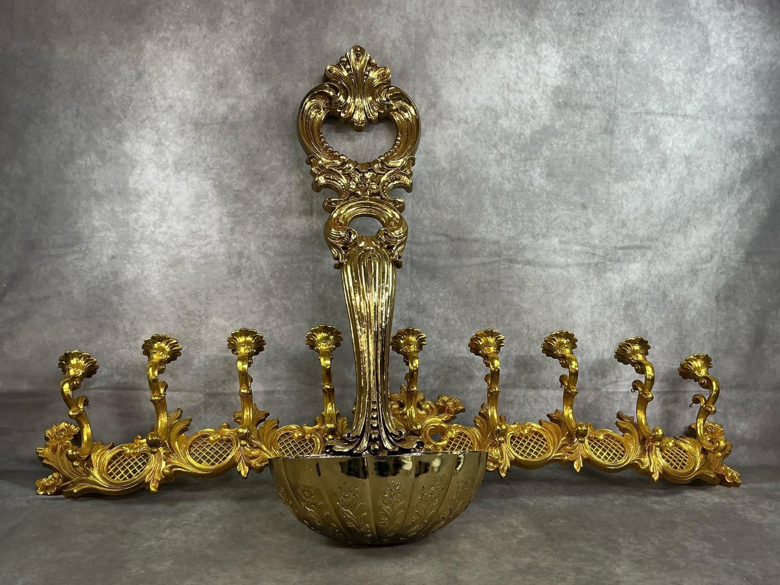 Syroco Wall Decorations: Two late 1900's Syroco gold gilt molded resin wall sconce and large ladle. Nine candleholders in long sconce with ornate scrollwork and ornate ladle with flowers and "bow" for floral arrangements. In
