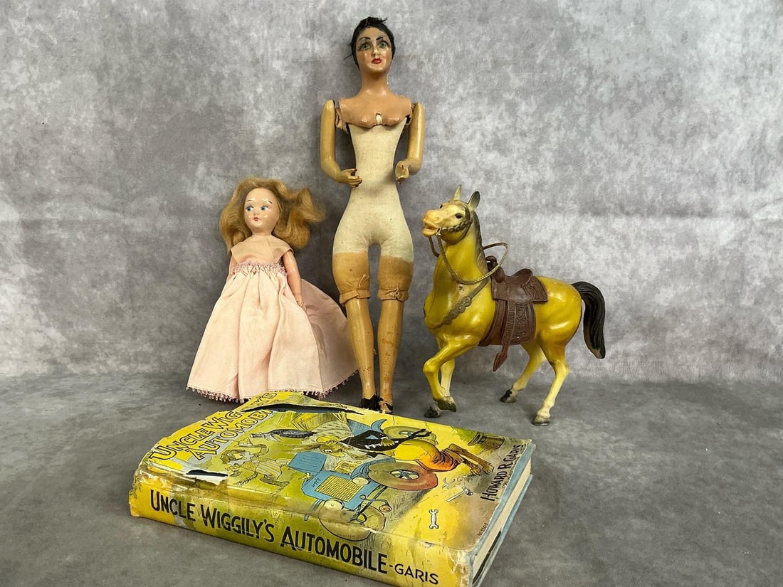 Dolls, Horse, & Uncle Wiggly Book: Four early to mid 1900's toys. Western plastic horse with saddle, 12" composite and cloth doll, 7" composite blond doll, and 1939 Uncle Wiggly's Automobile. Toys have age related wear, and book has