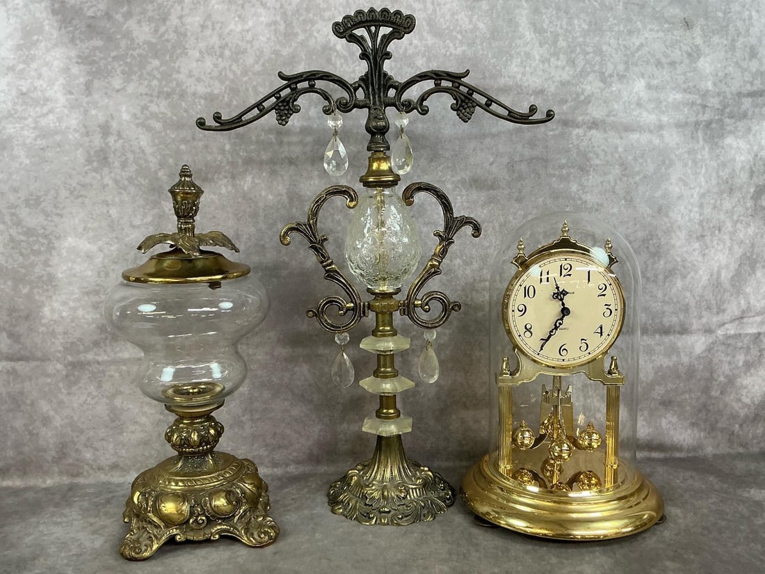Scales, Jar, & Clock: Three mid to late 1900's mantle or table pieces. Hollywood regency decorated scale of justice with crystals and gilt metal. Ornate glass and bronze jar with lid, and gold tone anniversary clock with