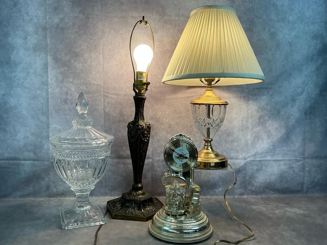 Lamps, Clock, & Crystal Urn: Four mid to late 1900's decorative pieces. Crystal diamond pattern heavy urn with lid by Godinger, and Rhythm quartz working clock with movable parts. Crystal and gold toned metal lamp and Meyda lion