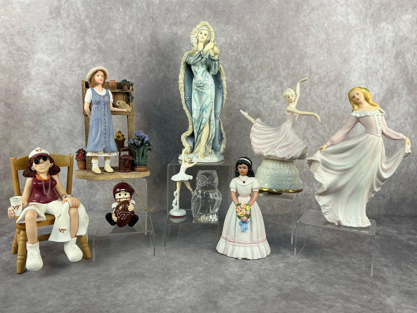 Home Interiors Figurines & More: Nine vintage collectibles. Lot includes four Home Interiors figurines, one princess house owl, a musical ballerina, a small unbranded ballerina, a J Manning Limited Edition Virginia Tech shelf sitter