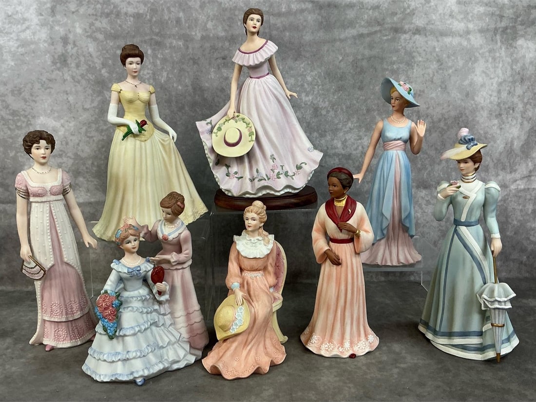Porcelain Ladies: Eight late 1900's porcelain figures. Homeco ladies include "Virginia Lynn", "Camille", "Louise", "Belle of the Bal", and more. In good condition. Lady with red rose measures 6 inches wide x 4 x 10 inc